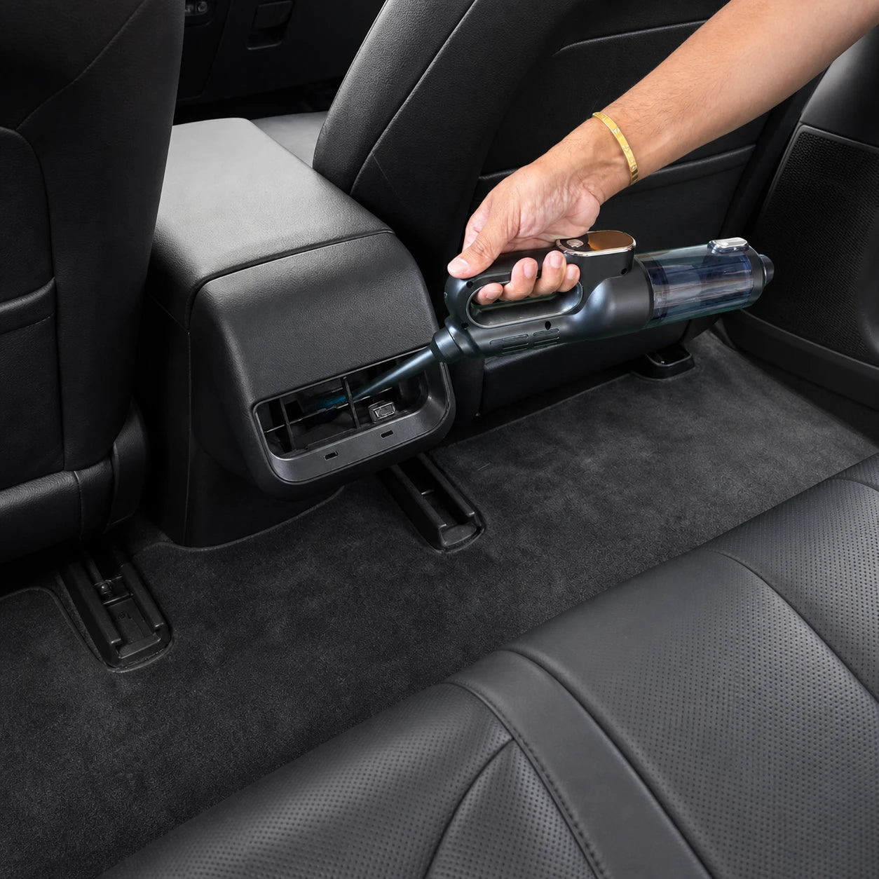 Compact Luminoire AutoCare vacuum cleaning a rear console vent