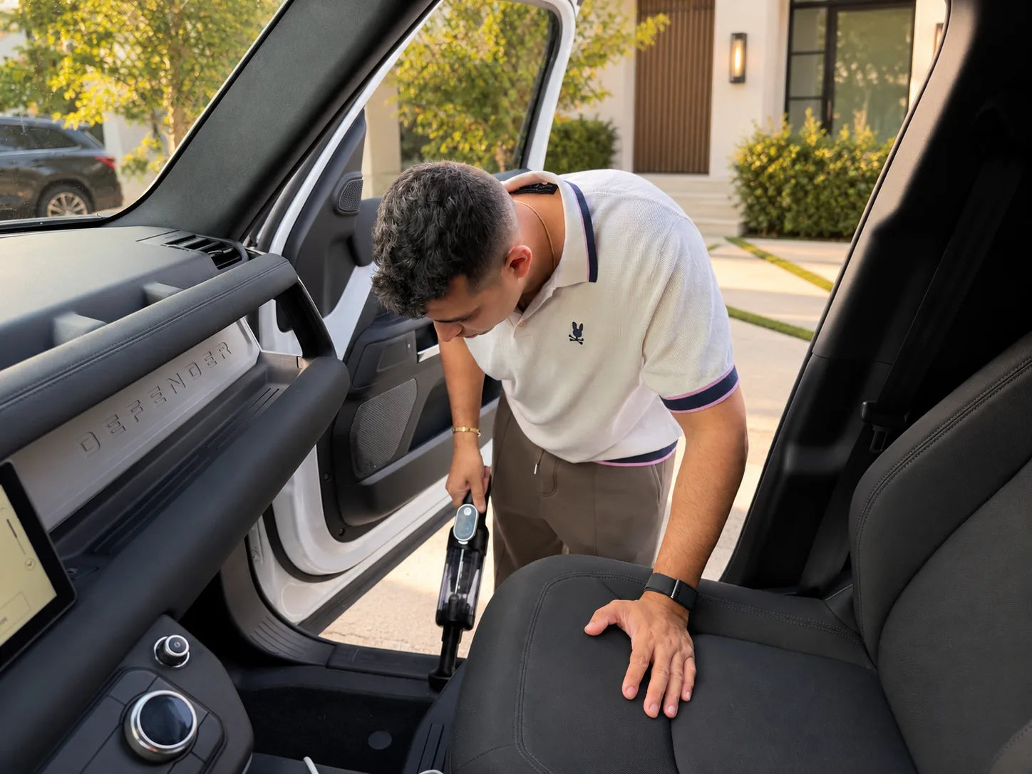The founder of Luminoire cleaning a rental vehicle